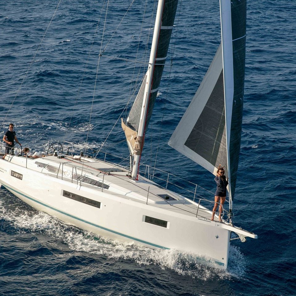 Sun Odyssey 410 monohull sailing with woman on bow