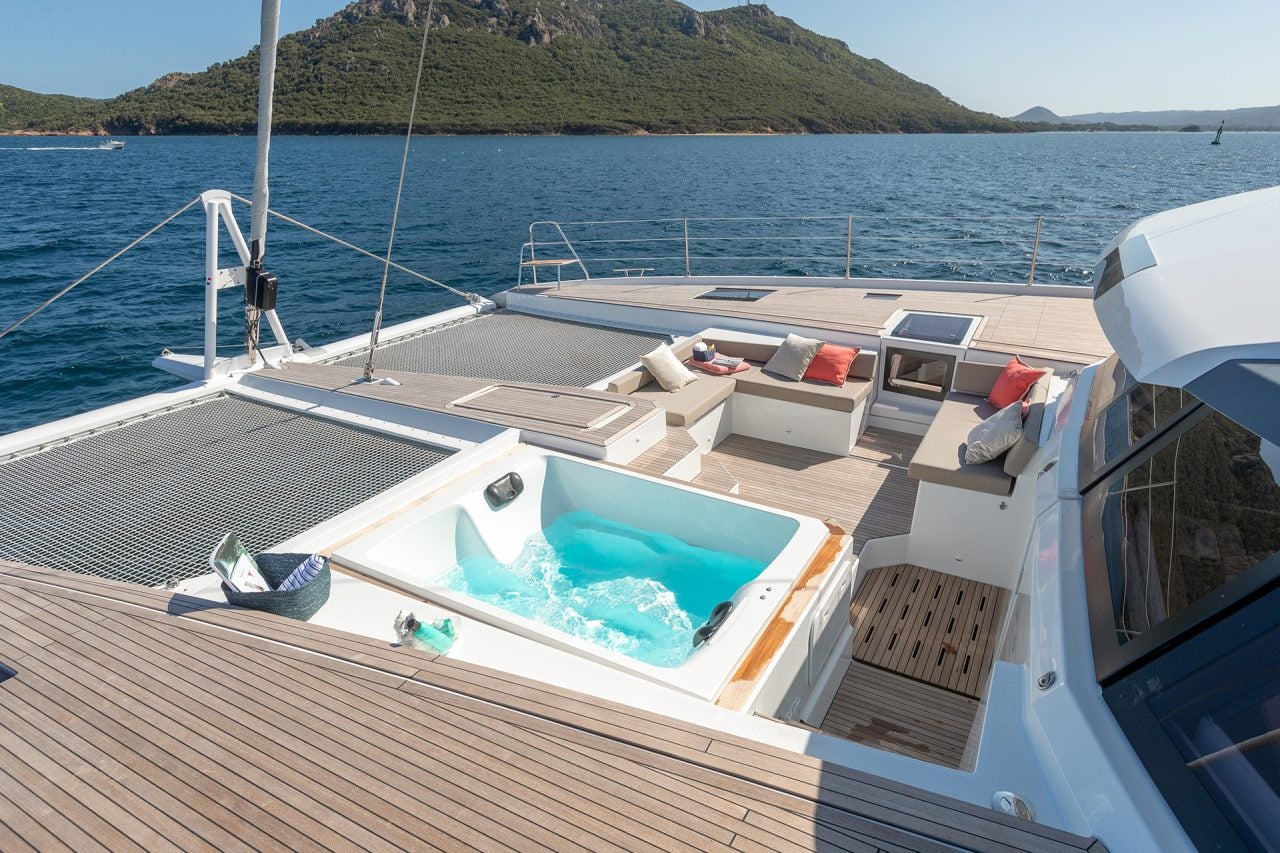 Foredeck of Alegria 67 luxury sailing catamaran with lounge area and hottub