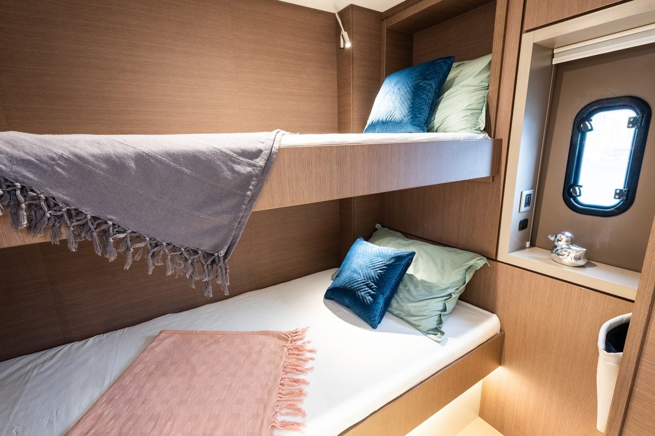 Bali 4.6 cabin with bunk bed berths and small port hole window