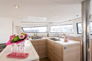 Large light wood kitchen with large windows and sea view on the Bali 5.4