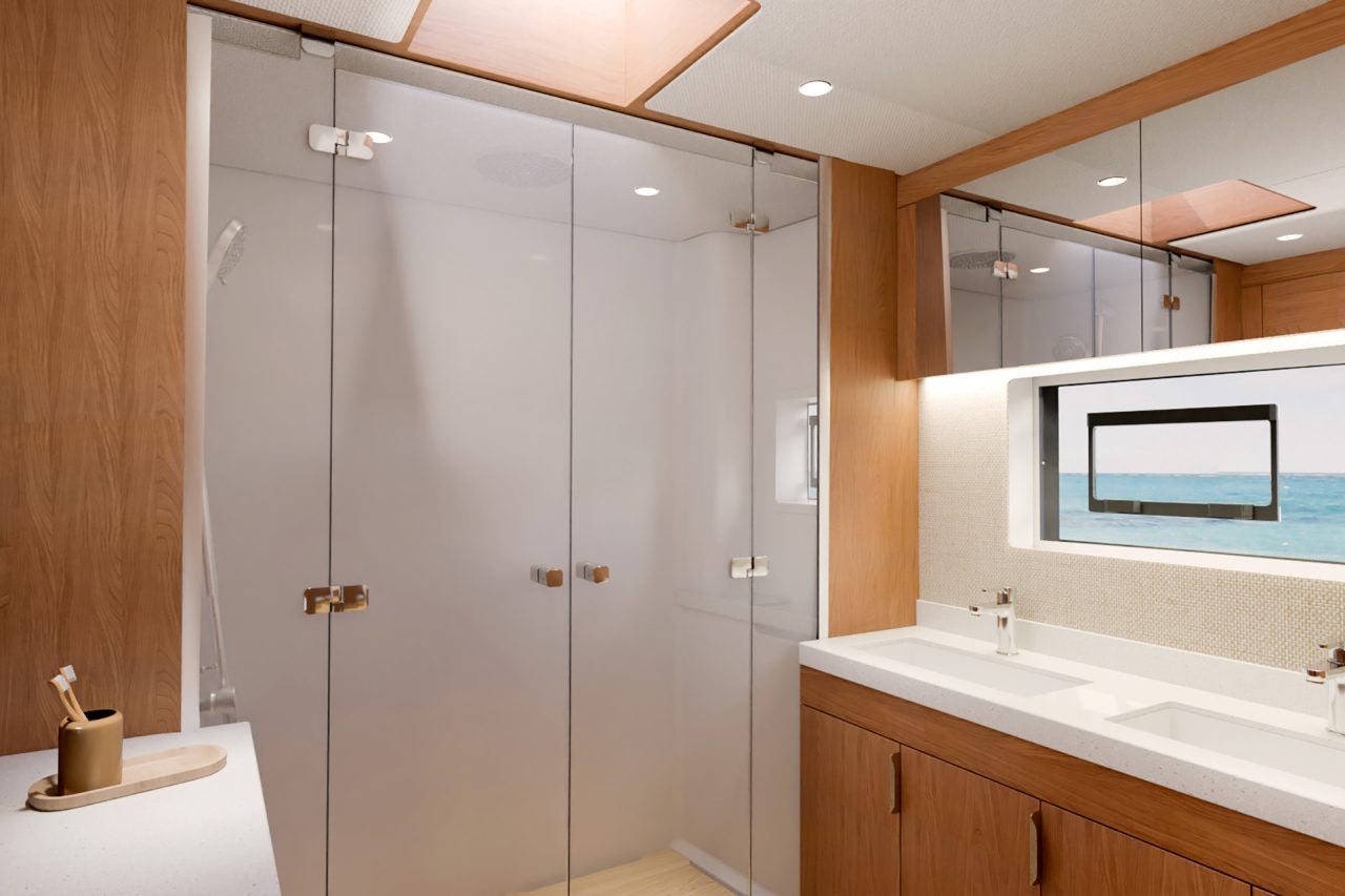 Salle de bain de la cabine du propriétaire avec double lavabo et douche à bord du Bali 5.8