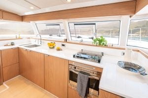 Kitchen with light wood cabinets on the Bali Catsmart catamaran