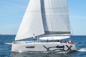 Excess 14 catamaran at sail with woman at the helm