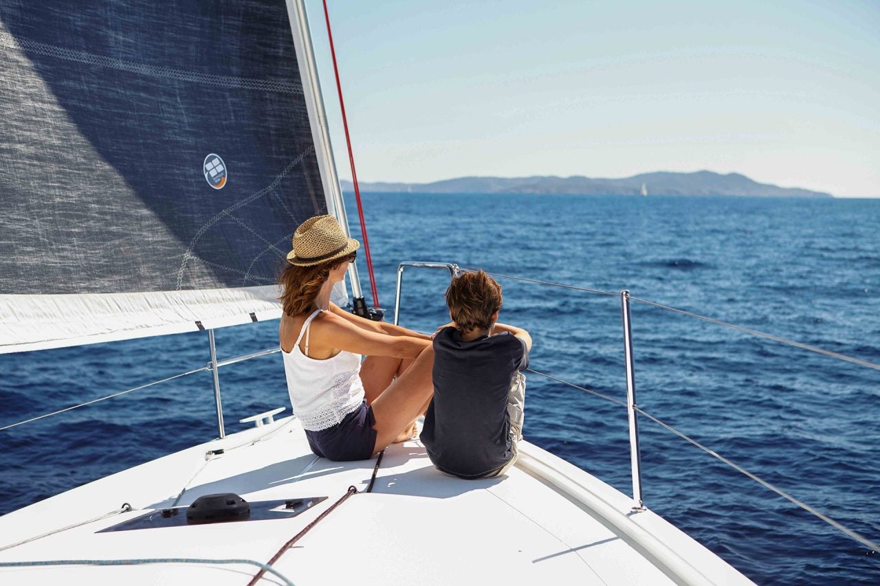 Woman and child on bow of the Sun Odyssey 410 monohull