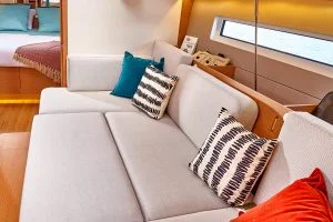 Cushioned seating of Sun Odyssey 440 sailboat salon