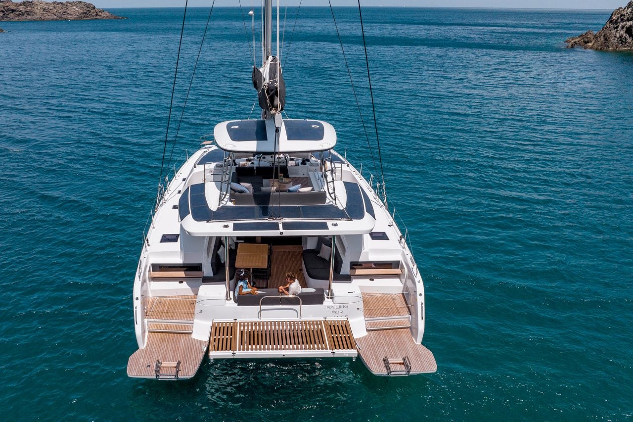 Aerial rear view of the Lagoon 51 catamaran at anchor