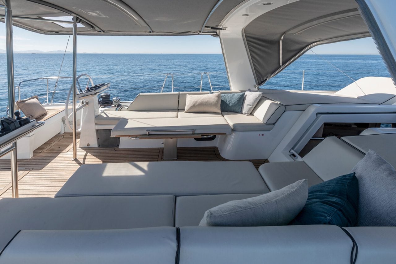 Lounge sunbeds in the cockpit of Beneteau Yacht 54 luxury sailboat