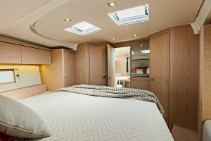 Large interior cabin with double bed on Oceanis 46.1 sailing yacht